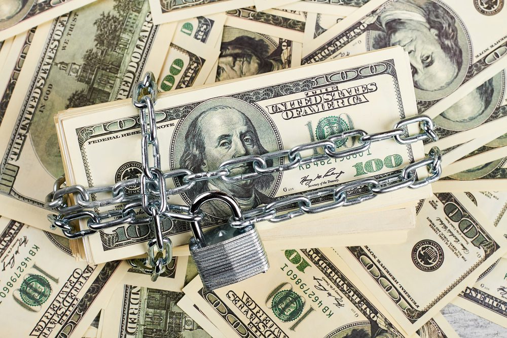 Chained and locked money.