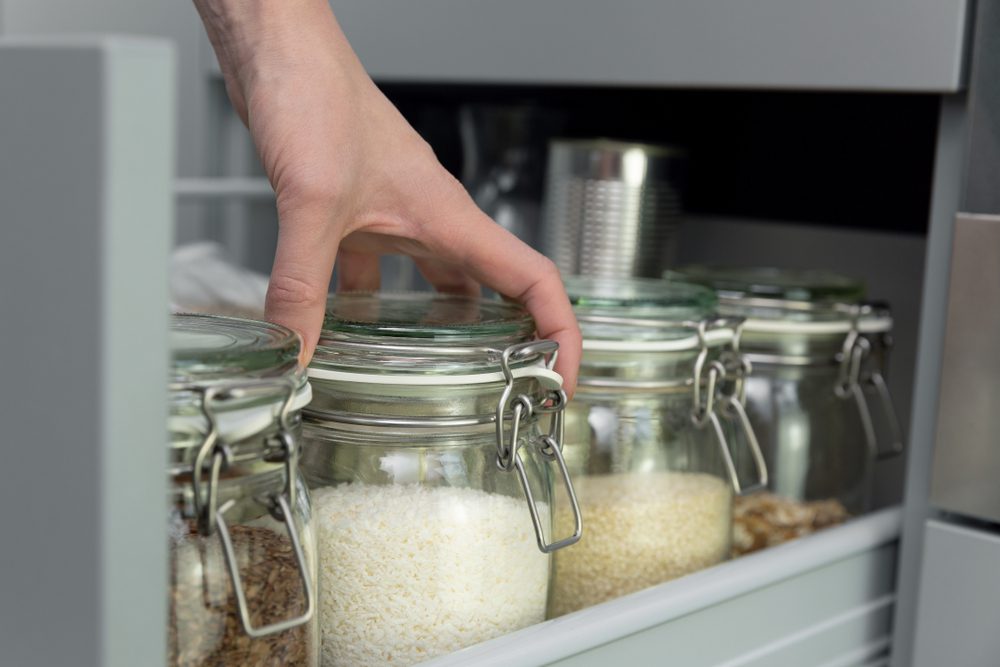 Organizing food in glass jars.